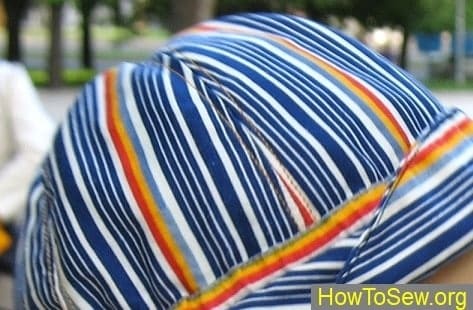 How to sew a child cap from striped fabric