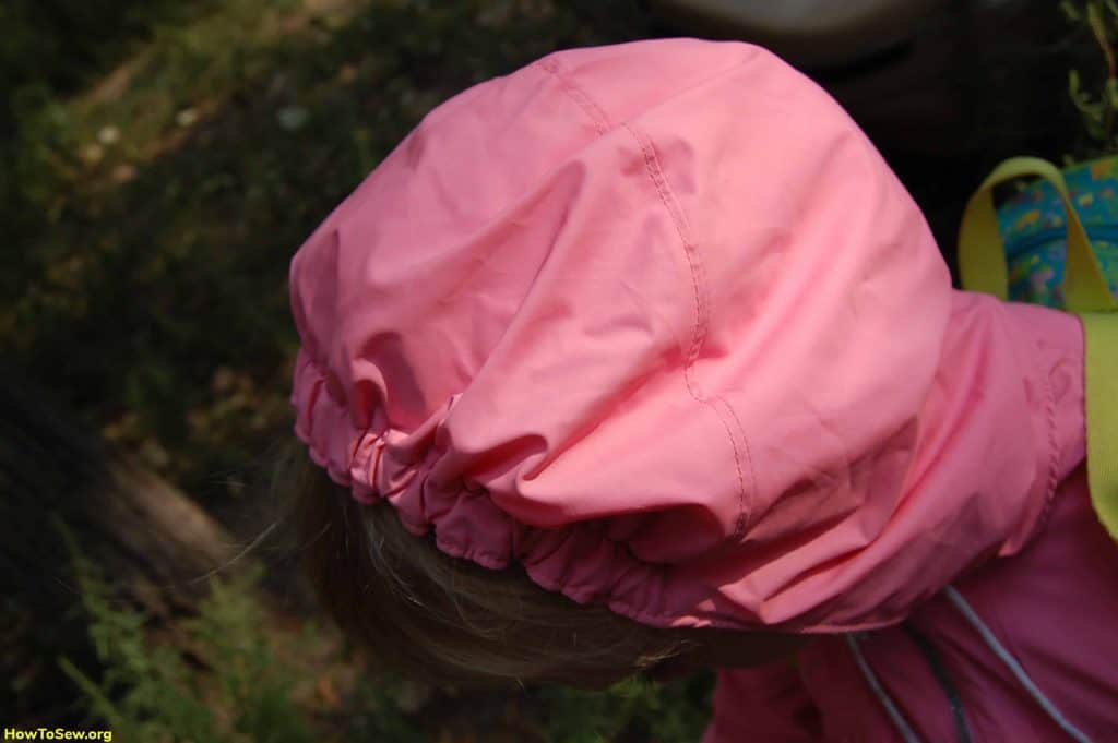 Kids raincoat for girls in pink with an original hood